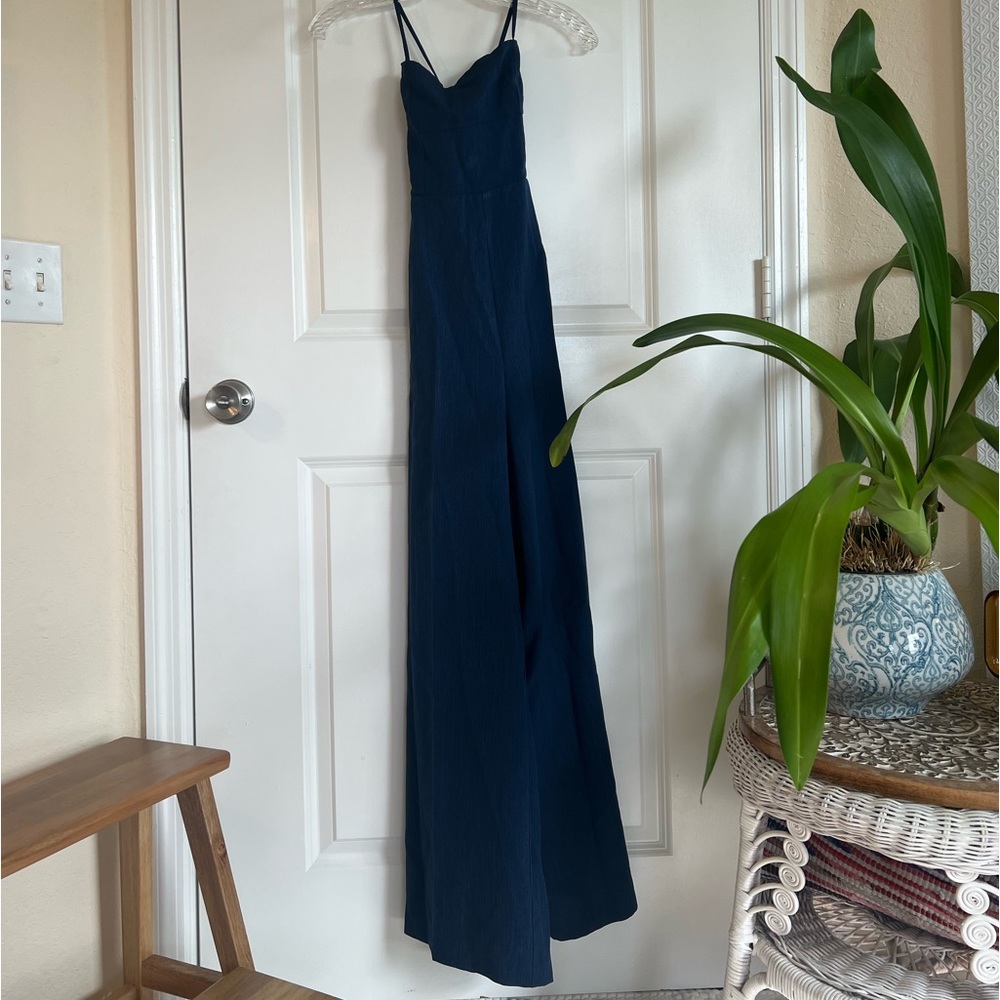 Navy full length jumpsuit with tie back detail